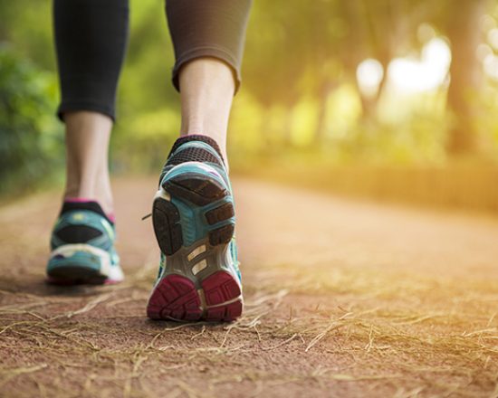 Woman running on a path.close up.